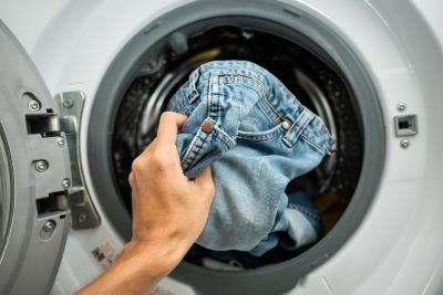 Taking clothes out of a washing machine